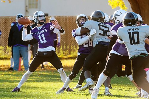 Quarterback Charlie Gauthier #11 of the Vincent Massey Vikings looks to make a pass during high school football action against the Elmwood Giants at Vincent Massey High School on Friday afternoon.
(Tim Smith/The Brandon Sun)