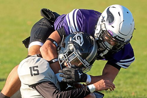 Haiden Samuel #3 of the Vincent Massey Vikings tackles Seth Ducharme #15 of the Elmwood Giants during high school football action at Vincent Massey High School on Friday afternoon.
(Tim Smith/The Brandon Sun)
