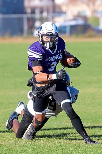 Haiden Samuel #3 of the Vincent Massey Vikings escapes the grip of Jerusalem Atobatele #19 of the Elmwood Giants while running the ball during high school football action at Vincent Massey High School on Friday afternoon.
(Tim Smith/The Brandon Sun)
