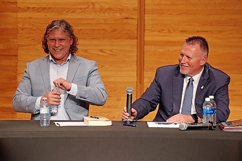 City of Brandon Mayoral candidates Jeff Fawcett and Len Isleifson laugh while taking part in the mayoral debate at Brandon University’s Lorne Watson Recital Hall on Friday evening. 
(Tim Smith/The Brandon Sun)