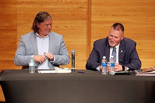 City of Brandon Mayoral candidates Jeff Fawcett and Len Isleifson laugh while taking part in the mayoral debate at Brandon University’s Lorne Watson Recital Hall on Friday evening. 
(Tim Smith/The Brandon Sun)