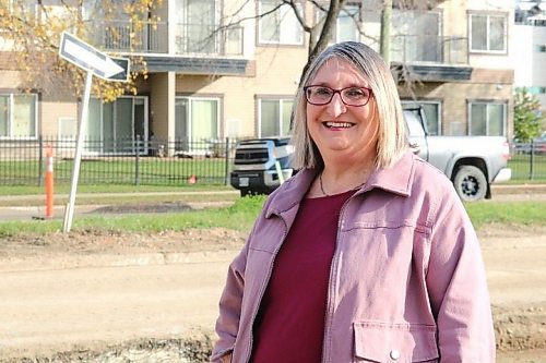 Ward 9 council candidate Norah Woychyshyn stands beside First Street, where she said she has spent time connecting with residents in the Westman Lions Manor leading up to the election. (Rylee Gerrard/The Brandon Sun)