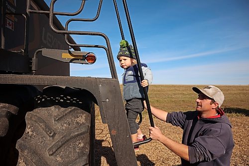 Travis Reimer helps his two-year-old daughter Naomi make her way up the ladder to their combine while helping harvest soybeans during the Acres of Hope Rivers and Oak River community harvest in support of the Canadian Foodgrains Bank at a field east of Rivers on Monday. Farmers from the area came together to harvest approximately 155 acres of soybeans, which will be sold at market with the proceeds going to the CFB. CFB has close to three dozen growing projects in Manitoba this year. The Acres of Hope harvest is the last of CFB project harvests for 2026. The CFB works to help provide resources in food insecure areas around the world with the aim of ending ending hunger. Dozens of volunteers are involved in the Acres of Hope project, donating time, seed, chemicals, equipment and anything else needed for the project. Six combines took part in the harvest on Monday, as well as grain carts and grain trucks. Combines harvest soybeans during the Acres of Hope Rivers and Oak River community harvest in support of the Canadian Foodgrains Bank at a field east of Rivers on Monday. Farmers from the area came together to harvest approximately 155 acres of soybeans, which will be sold at market with the proceeds going to the CFB. CFB has close to three dozen growing projects in Manitoba this year. The Acres of Hope harvest is the last of CFB project harvests for 2026. The CFB works to help provide resources in food insecure areas around the world with the aim of ending ending hunger. Dozens of volunteers are involved in the Acres of Hope project, donating time, seed, chemicals, equipment and anything else needed for the project. Six combines took part in the harvest on Monday, as well as grain carts and grain trucks.
(Tim Smith/The Brandon Sun)
