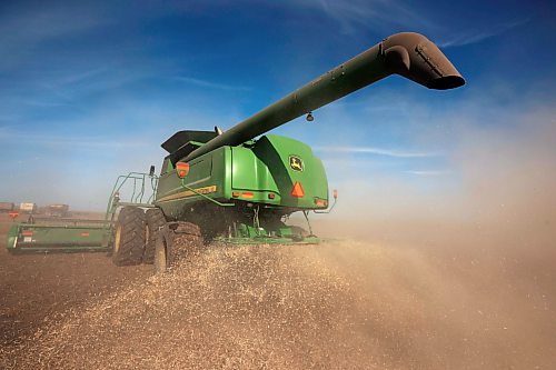 Chaff spits out of the back of a combine as it harvests soybeans during the Acres of Hope Rivers and Oak River community harvest in support of the Canadian Foodgrains Bank at a field east of Rivers on Monday. Farmers from the area came together to harvest approximately 155 acres of soybeans, which will be sold at market with the proceeds going to the CFB. CFB has close to three dozen growing projects in Manitoba this year. The Acres of Hope harvest is the last of CFB project harvests for 2026. The CFB works to help provide resources in food insecure areas around the world with the aim of ending ending hunger. Dozens of volunteers are involved in the Acres of Hope project, donating time, seed, chemicals, equipment and anything else needed for the project. Six combines took part in the harvest on Monday, as well as grain carts and grain trucks. Combines harvest soybeans during the Acres of Hope Rivers and Oak River community harvest in support of the Canadian Foodgrains Bank at a field east of Rivers on Monday. Farmers from the area came together to harvest approximately 155 acres of soybeans, which will be sold at market with the proceeds going to the CFB. CFB has close to three dozen growing projects in Manitoba this year. The Acres of Hope harvest is the last of CFB project harvests for 2026. The CFB works to help provide resources in food insecure areas around the world with the aim of ending ending hunger. Dozens of volunteers are involved in the Acres of Hope project, donating time, seed, chemicals, equipment and anything else needed for the project. Six combines took part in the harvest on Monday, as well as grain carts and grain trucks.
(Tim Smith/The Brandon Sun)