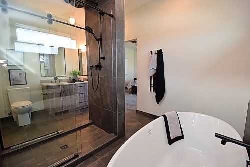 Todd Lewys / Free Press
A stunning double-sided walk-in shower was placed smartly between the vanity and freestanding soaker tub.