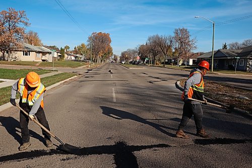 Workers with the Province of Manitoba fix potholes along First Street in Brandon on a sunny Tuesday morning.
(Tim Smith/The Brandon Sun)