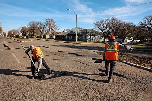 Workers with the Province of Manitoba fix potholes along First Street in Brandon on a sunny Tuesday morning.
(Tim Smith/The Brandon Sun)