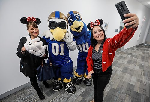 JOHN WOODS / FREE PRESS
Brittany Boschman, volunteer group leader, right, and thirty year volunteer Carol Eliasson take a photo with Buzz and Boomer during a Dreams Take Flight event at the Royal Aviation  Museum in Winnipeg, Tuesday, October 20, 2026.

reporter: av