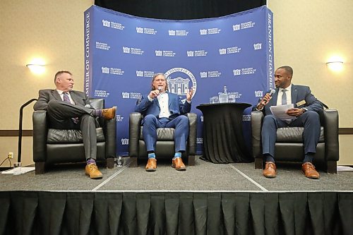 Sitting between mayoral candidate Len Isleifson, left, and Brandon Chamber of Commerce President Emelio Brown, incumbent Mayor Jeff Fawcett responds to a question during a Breakfast with the Mayoral Candidates event hosted by the Chamber at the Victoria Inn on Wednesday morning. (Matt Goerzen/The Brandon Sun)
