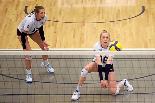 Cassidy Hauta, right, passes a ball last season. The senior opposite hitter will continue with passing responsibilities this year even though opposites typically stay out of the way during serve receive. (Tim Smith/The Brandon Sun)