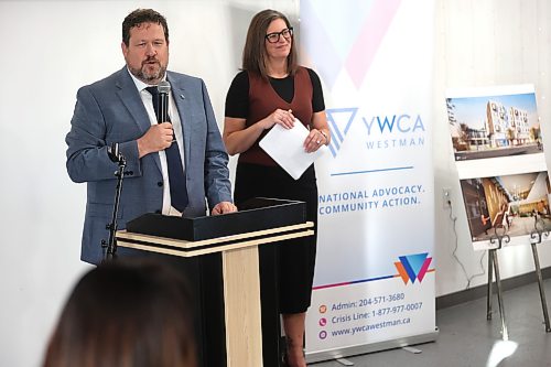 Municipal and Northern Relations Minister Glen Simard talks to the audience during the YWCA Westman's $40-million women’s campus community launch, while YWCA chief executive officer Lois Ruston looks on. Photos: Abiola Odutola/The Brandon Sun