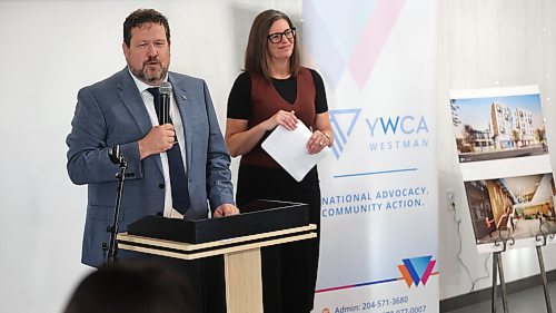 Municipal and Northern Relations Minister Glen Simard talks to the audience during the YWCA Westman's $40-million women’s campus community launch, while YWCA chief executive officer Lois Ruston looks on. Photos: Abiola Odutola/The Brandon Sun 