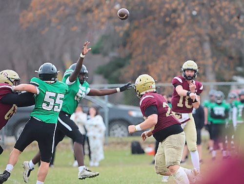 Easton Durgan locates a pass by Jake Cory during the game against Murdoch MacKay on Friday at Neelin High School. Durgan scored the first touchdown of his Winnipeg High School Football League career in his final regular-season game. (Rowan McCcarthy/The Brandon Sun)