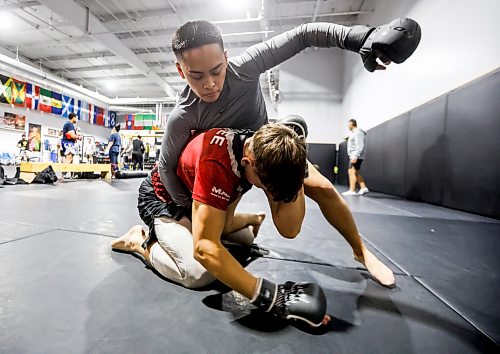 JOHN WOODS / FREE PRESS
Aidan Labao (top) spars with Yurii Banadyha during a training session at Dave’s Gym in Winnipeg, Monday, October 26, 2026. Labao won his first match with a TKO in 52 seconds.