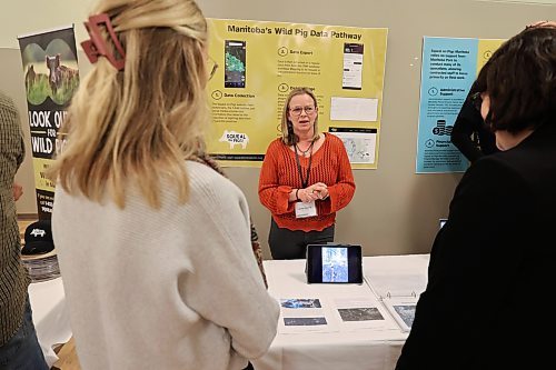 Laura Fanning of Squeal on Pigs showcases pig tracking technology and data uses at the summit. (Connor McDowell/The Brandon Sun)