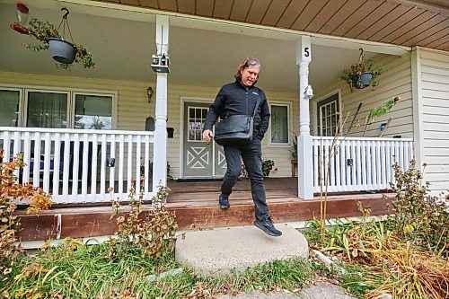 Incumbent mayoral candidate Jeff Fawcett steps down from the front porch of a home in Ward 3 while door knocking in the area on Tuesday before Wednesday’s municipal election. (Matt Goerzen/The Brandon Sun)
