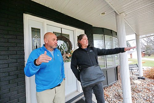 Incumbent mayoral candidate Jeff Fawcett, right, speaks with a Ward 3 resident on their front porch while door knocking in the area on Tuesday before Wednesday’s municipal election. (Matt Goerzen/The Brandon Sun)