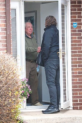 Ward 3 resident Herb Golden greets incumbent mayoral candidate Jeff Fawcett at his door on Tuesday morning. Fawcett was out door knocking in the area before Wednesday’s municipal election. (Matt Goerzen/The Brandon Sun)