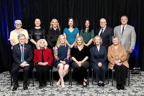 BROOK JONES/FREE PRESS
The 2026 Induction Class of 2026 are pictured before being inducted into the Maniotba Sports Hall of Fame during an induction ceremony at the Victoria Inn Hotel & Convention Centre in Winnipeg, Man., Thursday, Oct. 29, 2026. Pictured Back Row (L-R): Diane Piskainy-Hrychuk (athlete-multi sport), Mandy Marchak (athlete-rugby), Trisha (Eck) Hill (Team Jennifer Jones), Jill Officer (Team Jennifer Jones), Jennifer Clark-Rouire (Team Jennifer Jones), Wayne McMahon (athlete/builder-athletics), Vlastimil Cerny (builder-swimming). Front Row (L-R): Terry Dugid (Don Duguid - athlete - curling), Carol Jones (Coach Larry Jones' wife), Dawn (Askin) McEwan (Team Jennifer Jones), Jennifer Jones (Team Jennifer Jones), Cathy Gauthier (Team Jennifer Jones), and Georgina Wheatcroft (Team Jennifer Jones).