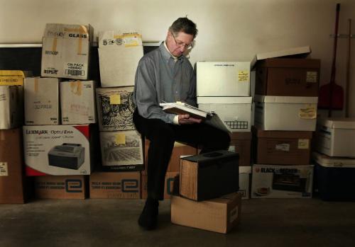 Jim Tindle looks through boxes of material in his garage at his home in South Vancouver British Columbia.  **For Dan Lett story  Lyle Stafford/Winnipeg Free Press