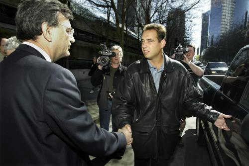 Frank Biller (R) shakes hands with his lawyer after  leaving the British Columbia Supreme Court in Vancouver April 30, 2002. Biller has been charged with 33 counts of fraud and theft in the Eron Mortgage scandal.  Lyle Stafford/Winnipeg Free Press