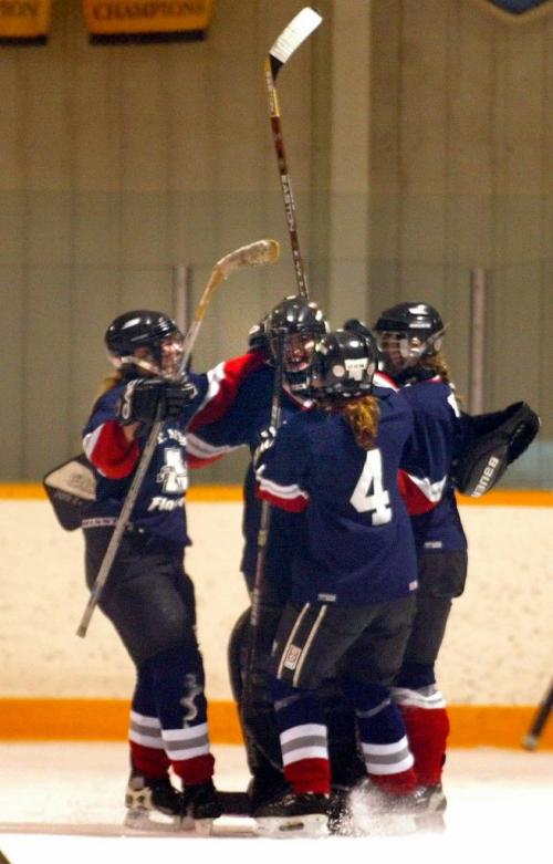 PHIL HOSSACK / WINNIPEG FREE PRESS 030312 St Mary's Flames celebrate their 1-0 victory over the Oak Park Raiders Wednesday afternoon. The win gave them the Winnipeg Women's High School Hockey Championship. See Ashley's tale.