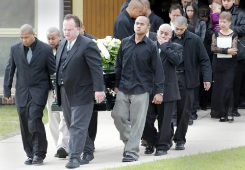 JOE BRYKSA/WINNIPEG FREE PRESS Local-(See Kevin's story)- Friends and family hug as Funeral services were held Monday morning for murder victim Johndrick Tan at at St Jospeh's  Roman Catholic Church in the Northend - JOE BRYKSA/WINNIPEG FREE PRESS