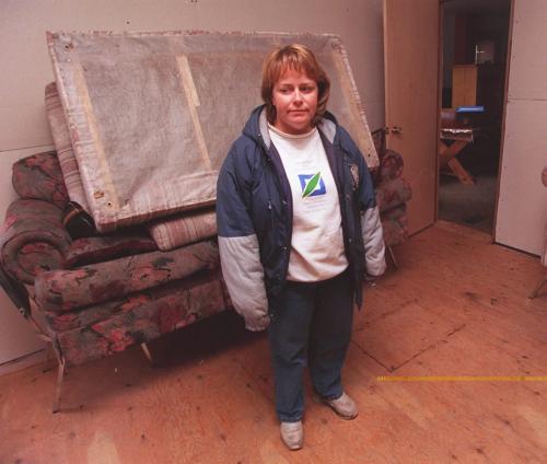 St Pierre Jolys- Michele Roeland stares at her water logged room adition in her home after flood waters rushed in last sunday night-The town was evacuated last week and residents were allowed back today for the first time to see the damage.   Joe Bryksa-Winnipeg Free Press