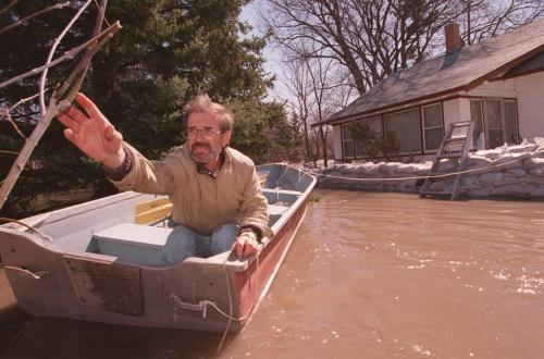 wfp101-winnipeg-flood 97--Ralph Taupe tries to leave his home at 740 Holly Ave to get more gas for his water pumps.-- HIs home is surrounded by a 18,000 sandbag dike but he says he has " just about had the biscuit".  marc gallant winnipeg free press