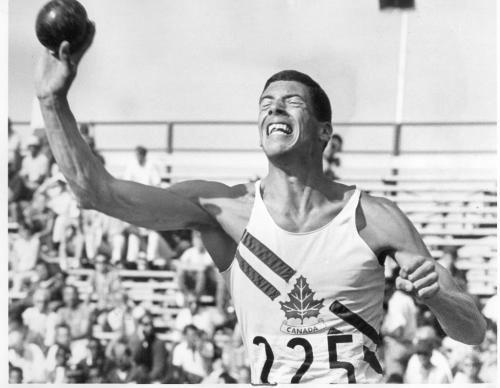 Winnipeg, August 1, 1967. Steve Spencer of Vancouver strains every muscle in heaving the shot put in his decathlon event. Winnipeg Free Press file photo.