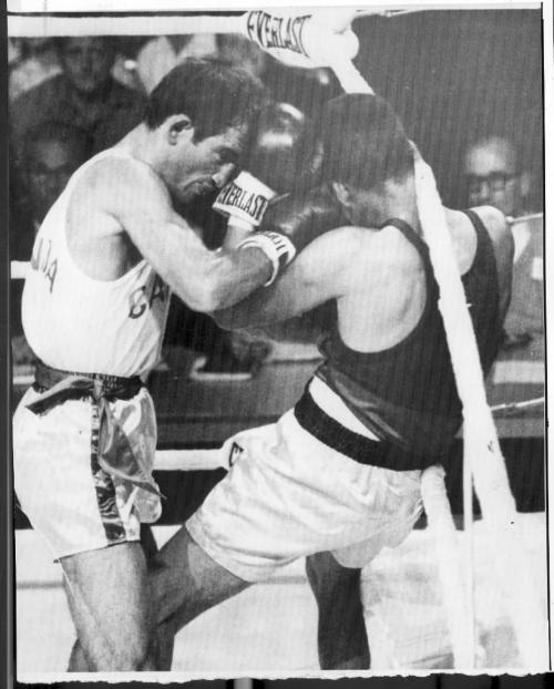 Winnipeg, August 2, 1967. Walter Henry (left) of Orillia, Ont. pounds opponent Jaimie Cabera of Ecuador to win the flywieght decision. Winnipeg Free Press file photo.