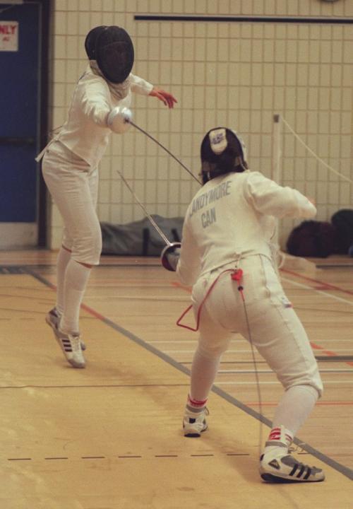 KITTIE WONG/WINNIPEG FREE PRESS Argentine fencer E. Aguero (left) attempts to score a point on Canadian Heather Landymore during the individual women's epee preliminaries Tuesday morning, Aug.3, 1999 in Winnipeg during the Pan Am Games.