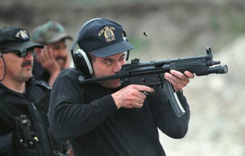 May 26, 1999--Rossburn, MB--Const. Rob Mangles of the Thompson detachment fires a MP-5 Submachine gun during drills at a gravel pit near their camp. RCMP from around the province are currently on two day exercises near Rossburn. Photo by Fred Greenslade