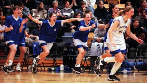 Sports-(See Ashley's story)- The Oak Park Raiders girls basketball bench goes nuts to join teamates after winning the 1999 AAAA high school basketball championship against St Mary's academy saturday night at the Investors Athletic Center at University of Winnipeg- Joe Bryksa photo- Mar 20, 1999