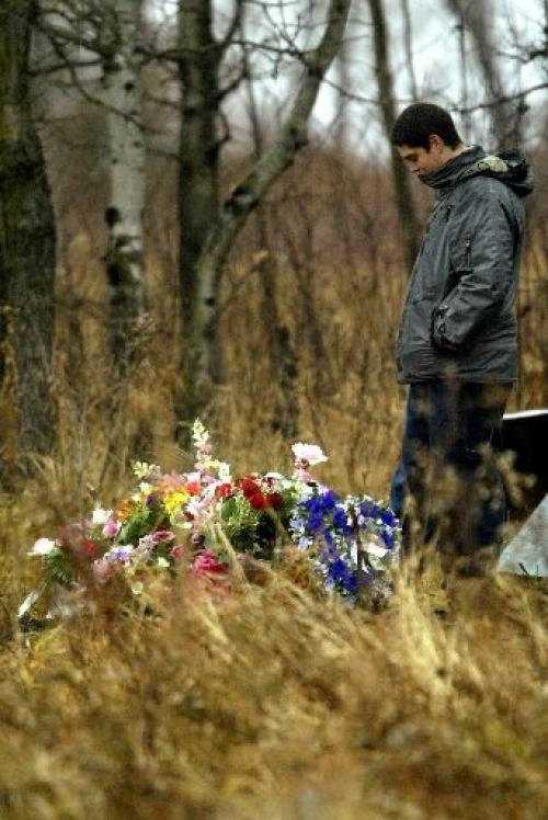 CHRISTOPHER PIKE / WINNIPEG FREE PRESS 20051112 A family member of Paige Merrick takes a moment to himself after her funeral at Long Plain First Nation reserve on Saturday Nov. 12, 2005.  matches story by: GG