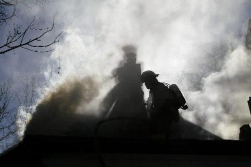 CHRISTOPHER PIKE / WINNIPEG FREE PRESS 20051024 Fire fighters fight a blaze at 267 Boyd Street in Winnipeg on Monday Oct. 24, 2004. There were no injuries in the blaze.