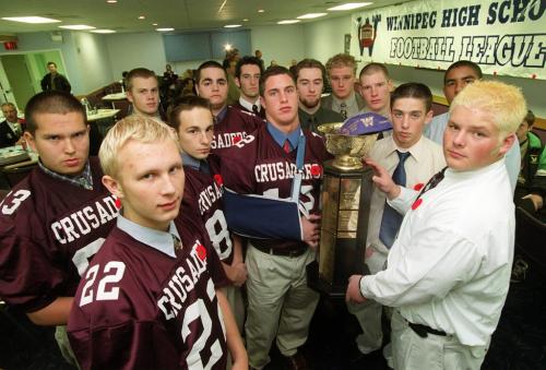 KEN GIGLIOTTI \ WINNIPEG FREE PRESS  ANAVETS Bowl 2000 finalists . for the Winnipeg High School Football League \will play off Sat at 2pm at the Stadium\in pic left St. Paul's  Crusaders team reps  , John Bracken injued payer holding trophy , and Oak Park Raiders team reps and Jason  Penner  holding the John Potter ANAVET Cup trophy right-\kg nov 1 2000