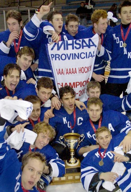 JOE BRYKSA/WINNIPEG FREE PRESS Sports-(See Chris's story)- The River East Kodiaks team celebrates after they won the AAAAProvincial High School Hockey Championship sunday afternoon with a 5-2 win over the Oak Park Raiders- Mar 12, 2001