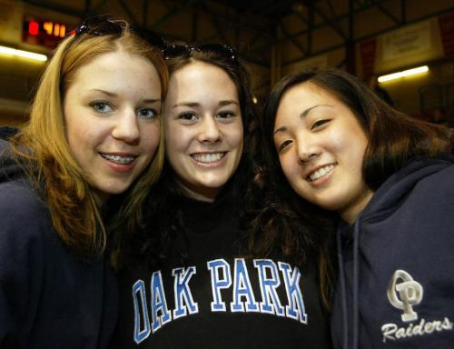 KEN GIGLIOTTI / WINNIPEG FREE PRESS / MAR 18 2004  FACES -"AAAA" PROVINCIAL BASKETBALL HIGH SCHOOL CHAMPIONSHIPS  semi FINAL -IN PIC LEFT TO RIGHT Oak Park Raiders fans  left to right , Alycia Maskiew , Marnie Couchman , Andrea Kaita  , at womens  game thurs vs  River East-kg